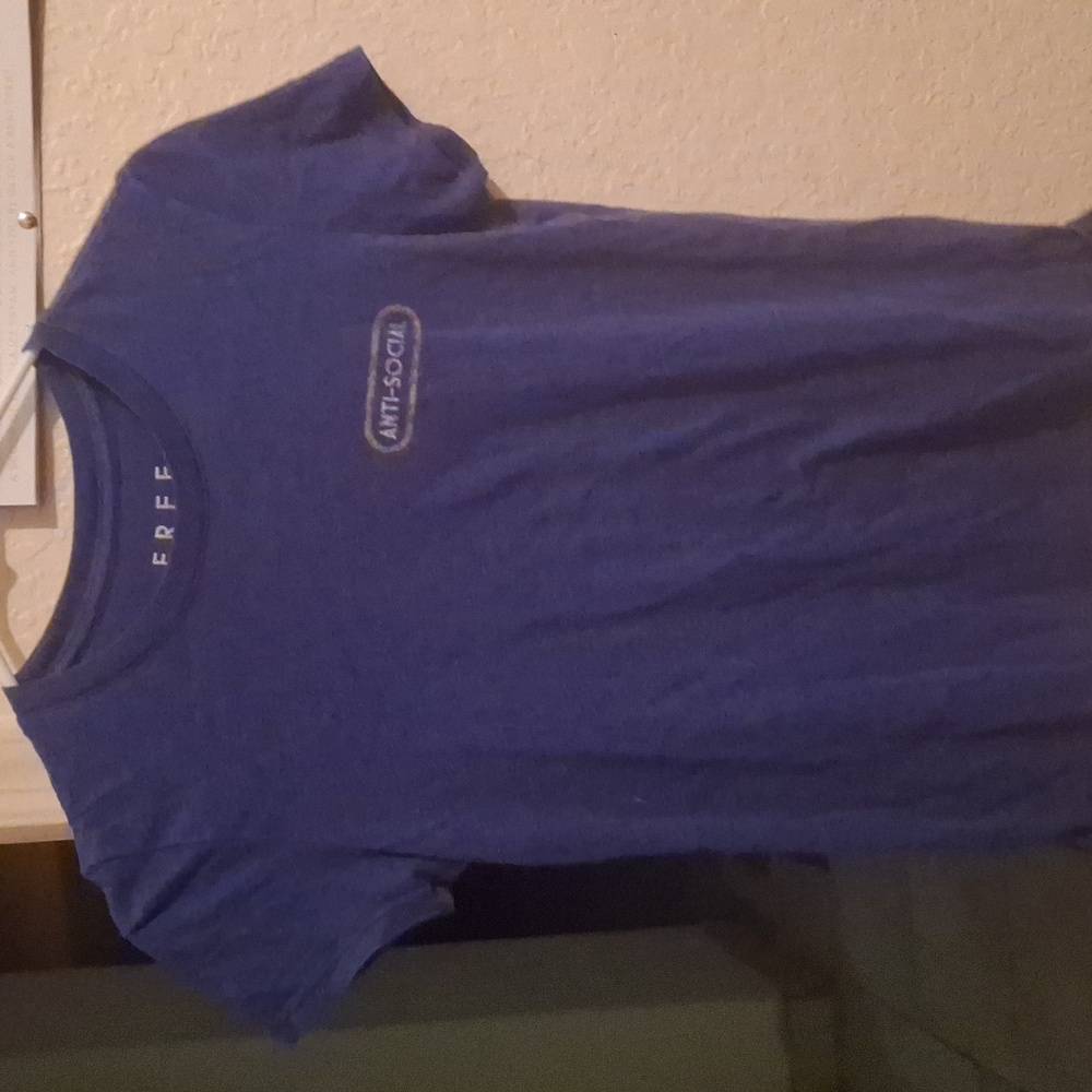 A purple shirt that says anti-social